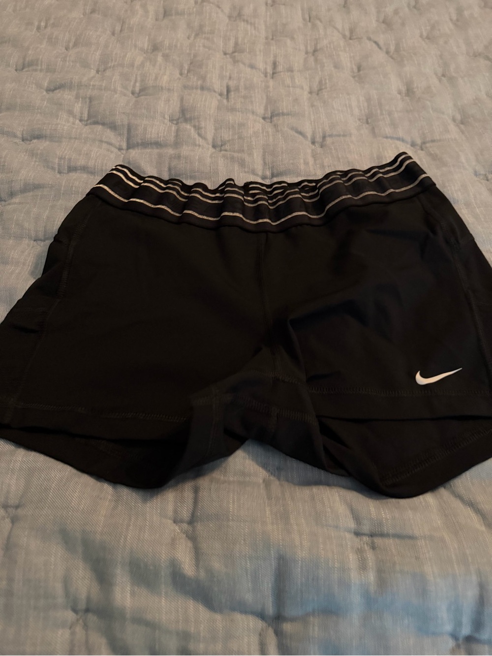 Nike Women's Black Athletic Shorts with White Swoosh and Striped Waistband
